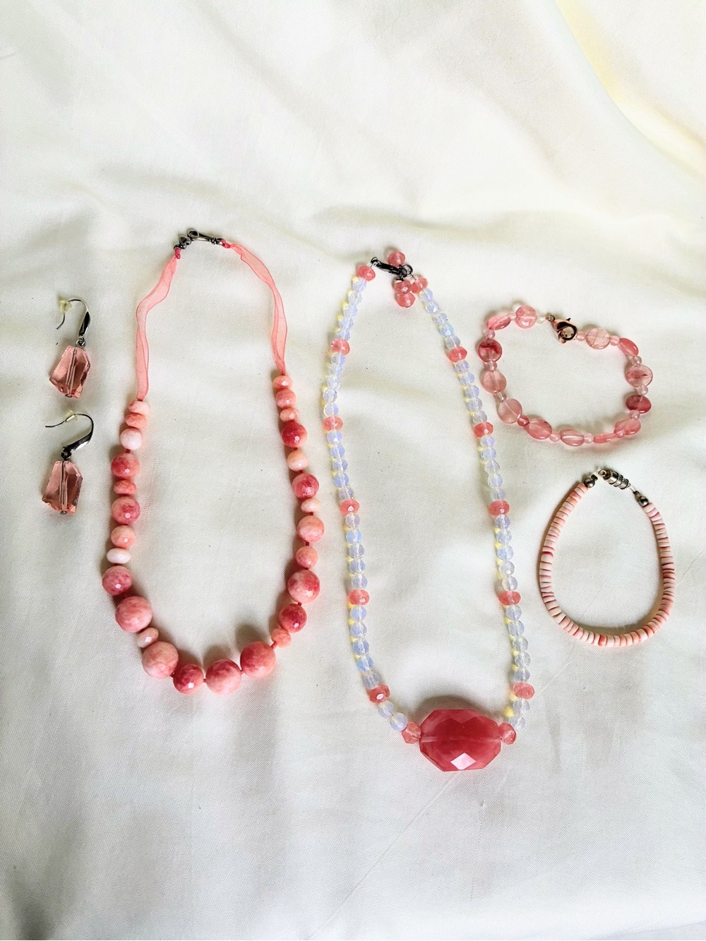 Pink beaded jewelry set 2 necklaces 2 bracelets & 1 pair of earrings